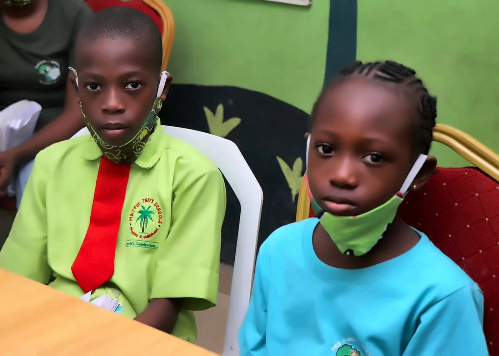 Fruitful Trees pupils seated together at a classroom table.