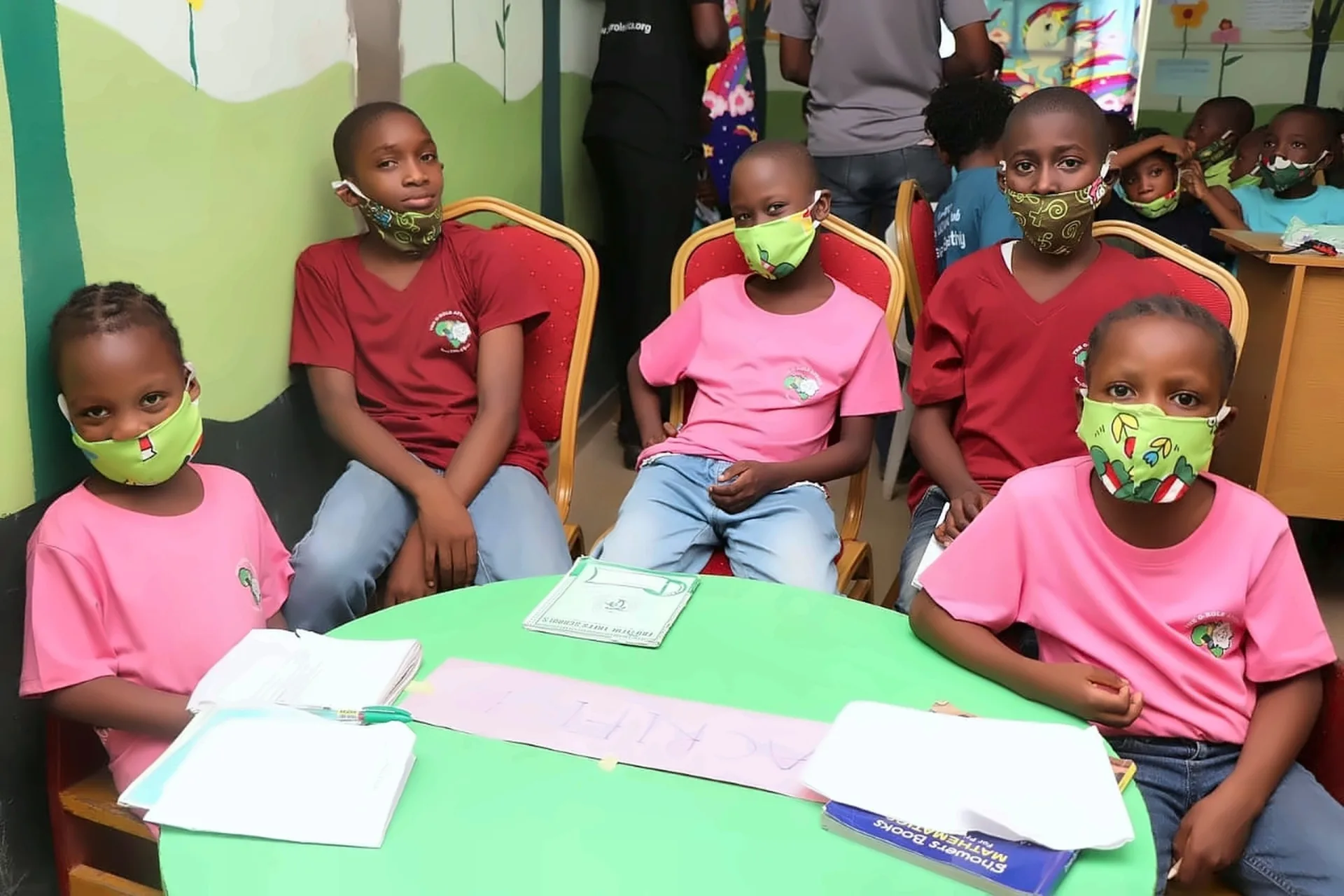 Fruitful Trees pupils working with mathematics books around a classroom table.